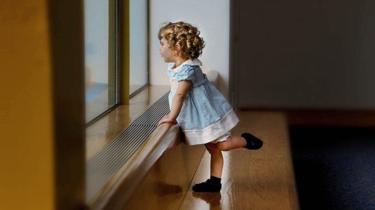 What's the Best Floor Plan for a Family? - Little girl looking out of a window